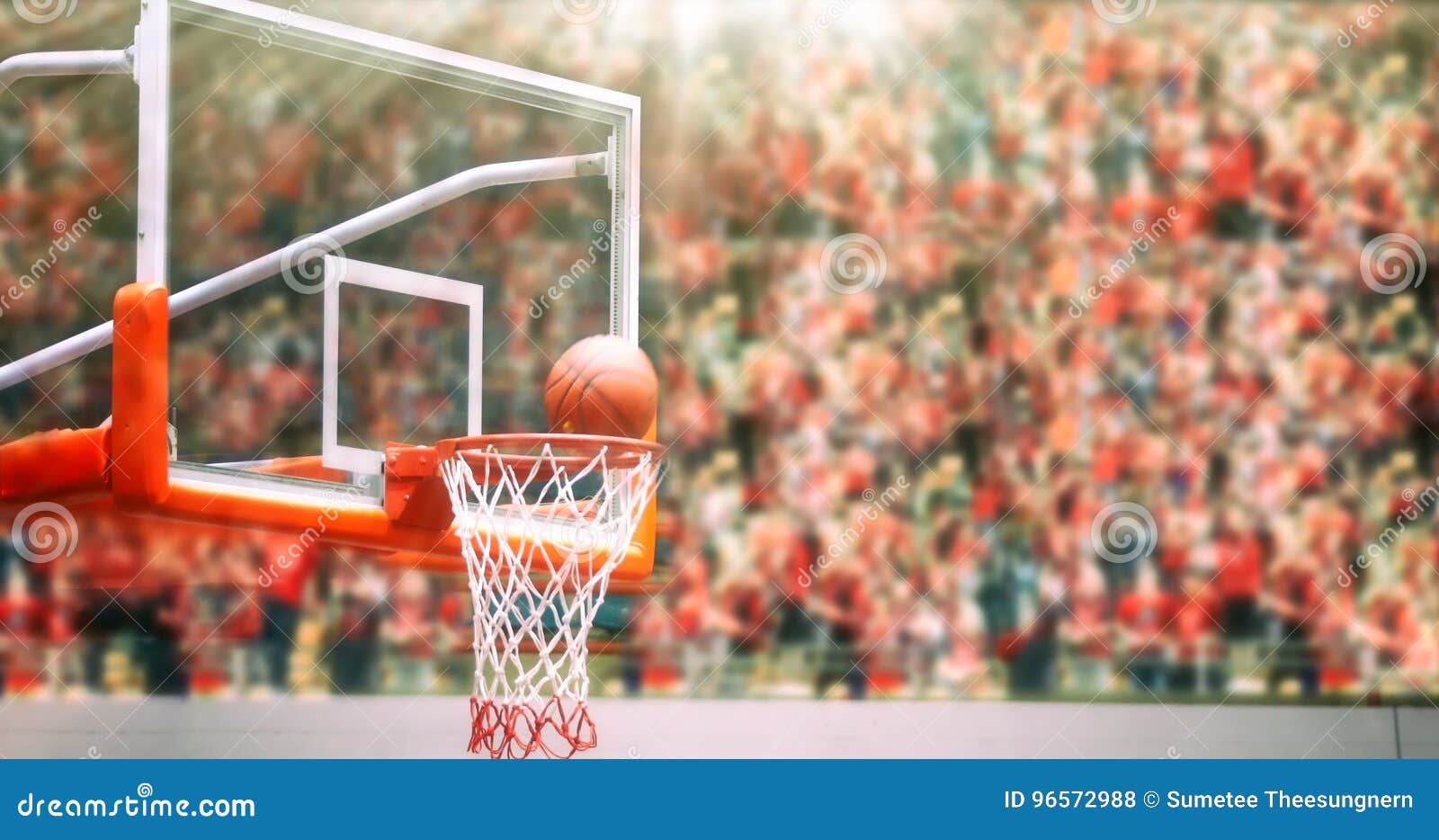 Basketball Going through Net and Scoring during Match ,Blurry an Stock