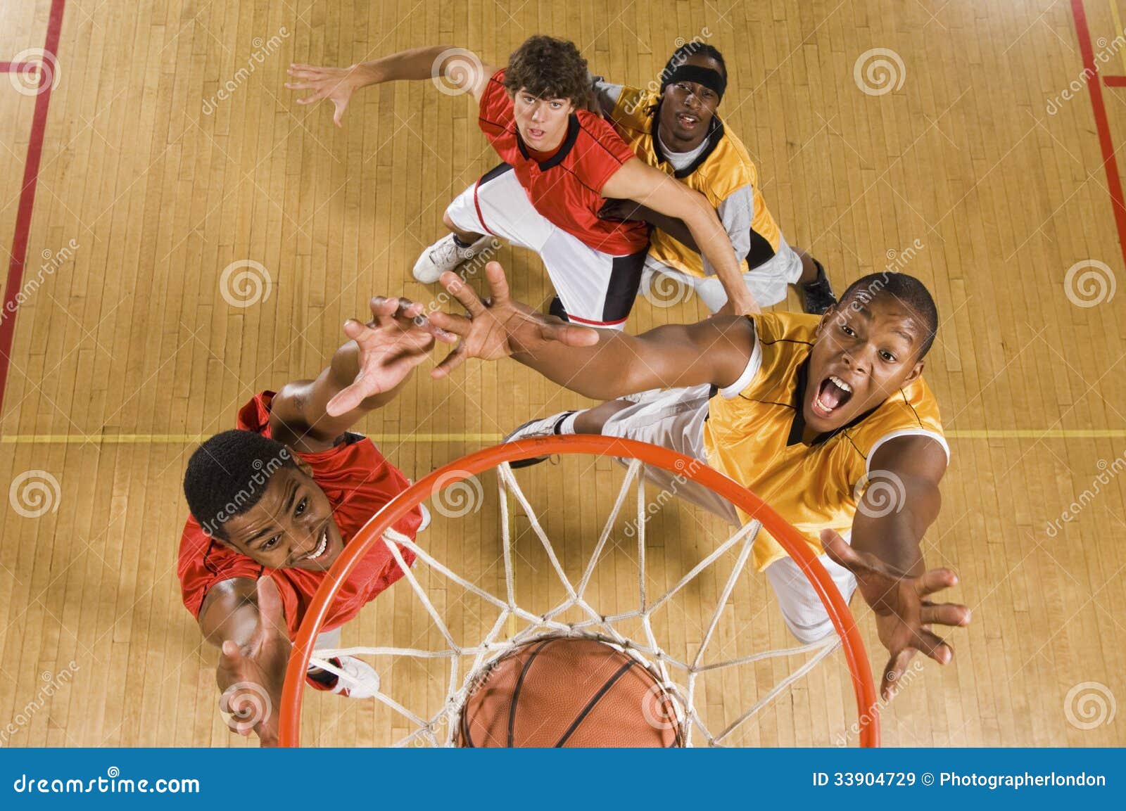 Basketball Player Dunking Basketball in Hoop Stock Image Image of