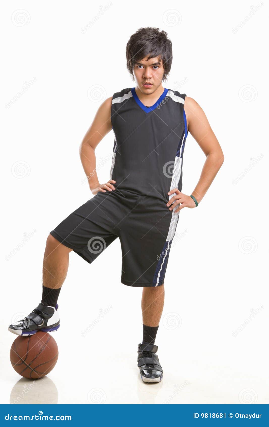 Free Photo | Happy black basketball player in green and white outfit  holding a vintage brown basketball, dynamic pose on white