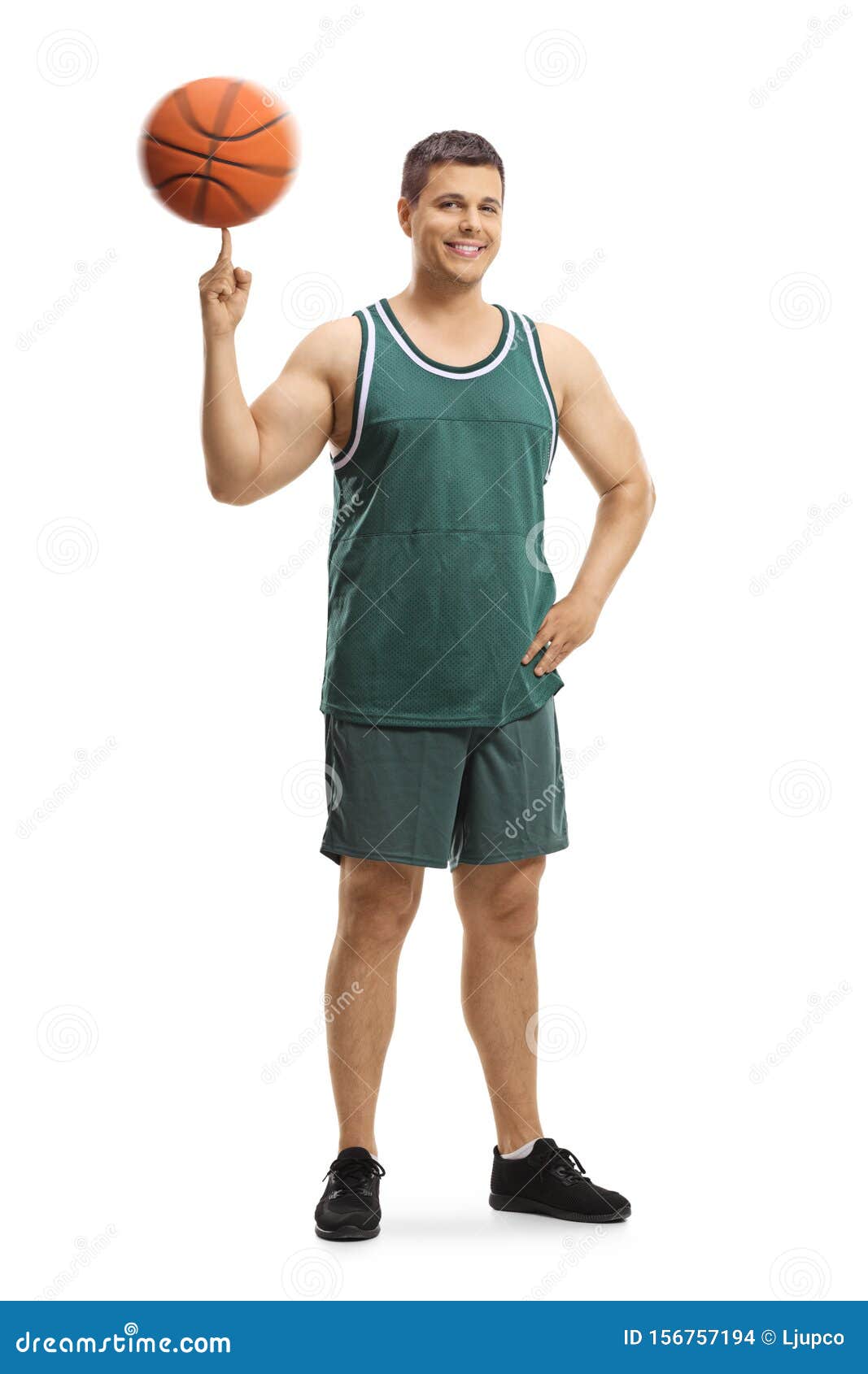 Basketball Player Standing and Spinning a Ball on a Finger Stock Photo ...