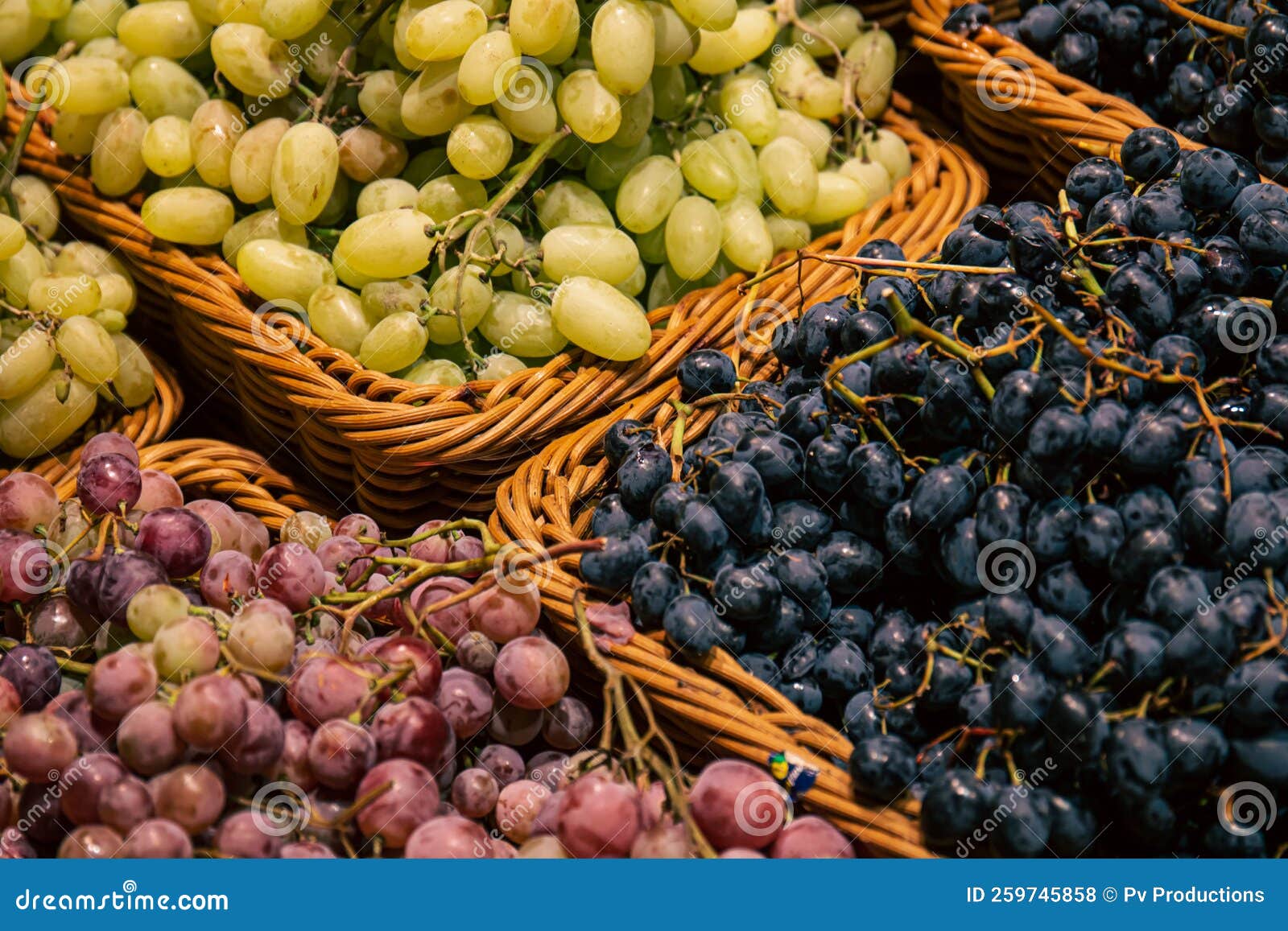 Baskets with Different Types of Grapes on a Supermarket Showcase. Stock ...