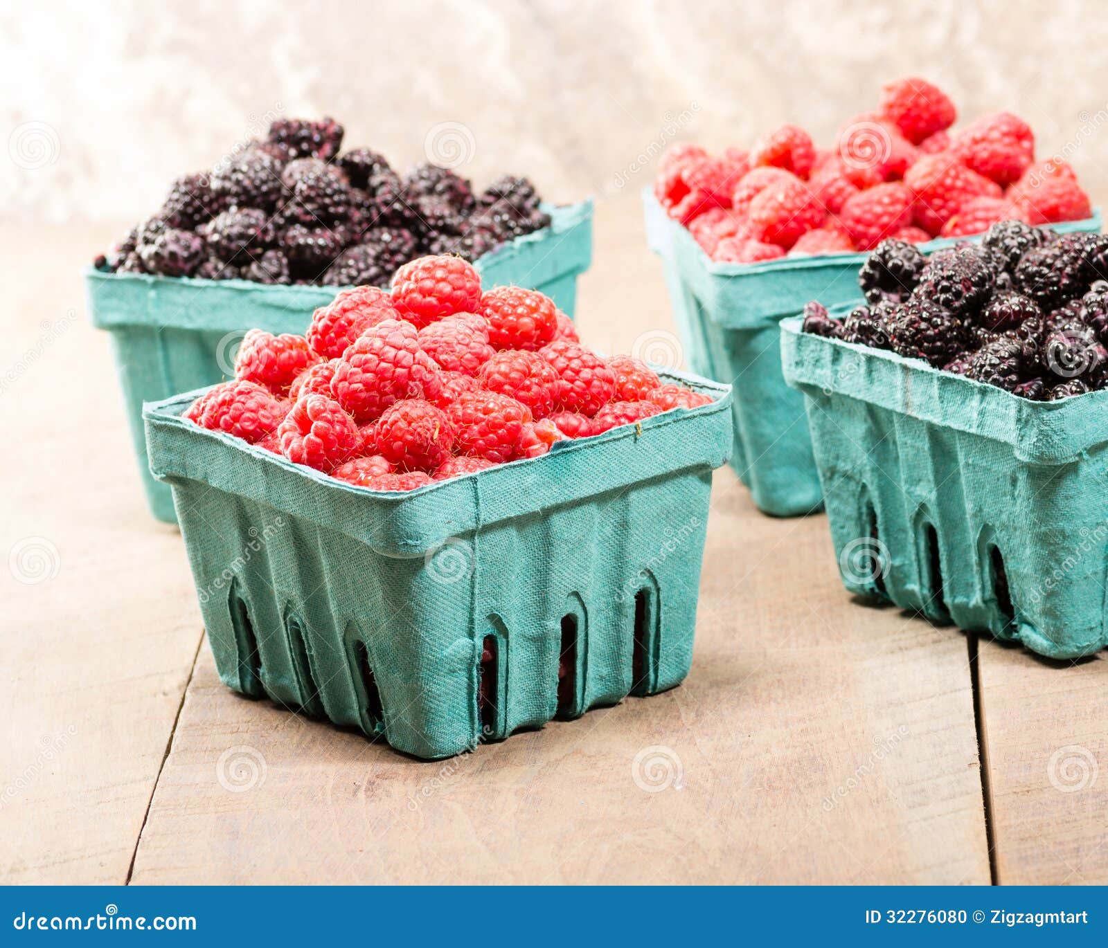 Baskets of Fresh Red Raspberries and Black Raspberries Stock Photo