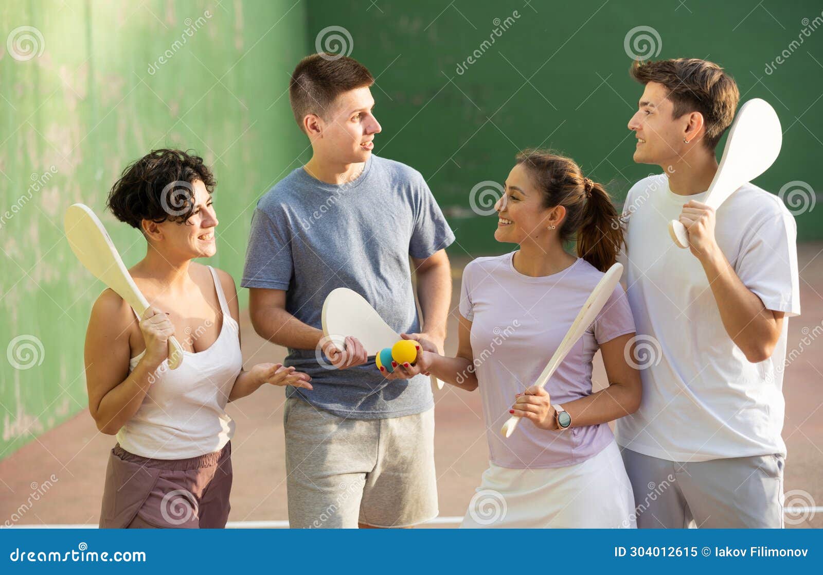 basque pelota players chatting on outdoor fronton