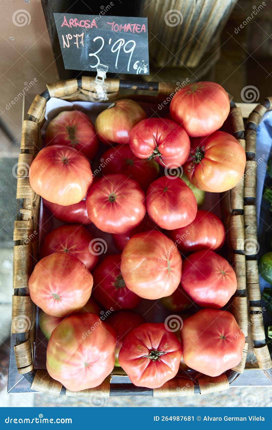 a basquet of pink tomatoes
