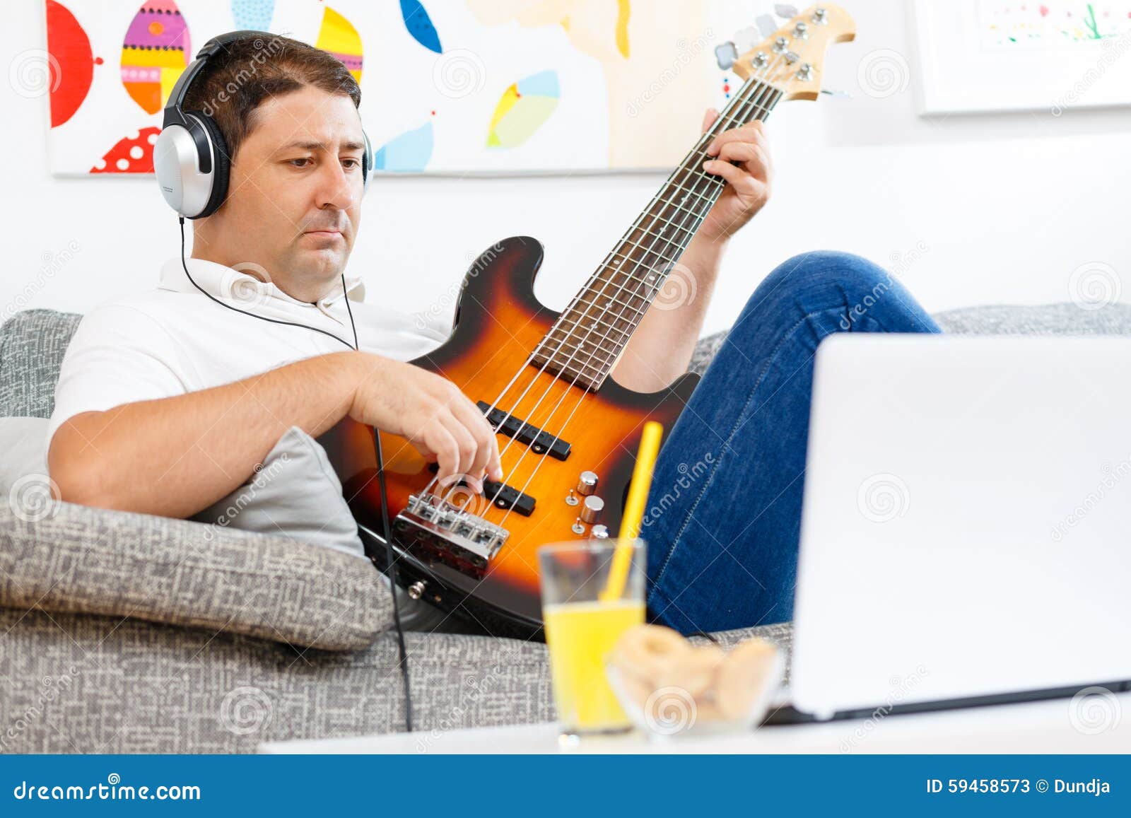 Bass player stock image. Image of couch, guitar, nelectric 59458573