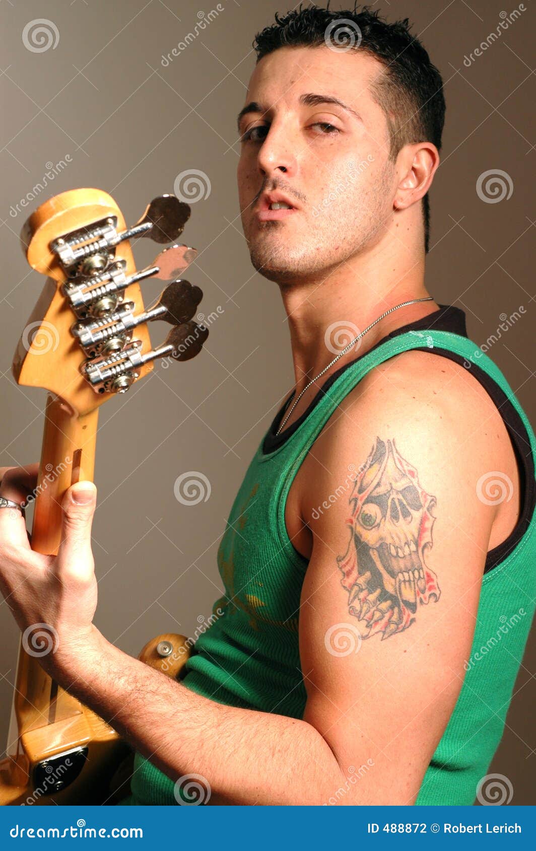 Tattooed Musical Notes and Intricate Design on a Young Mans Tattoo with  guitar AI Generated 31742589 Stock Photo at Vecteezy