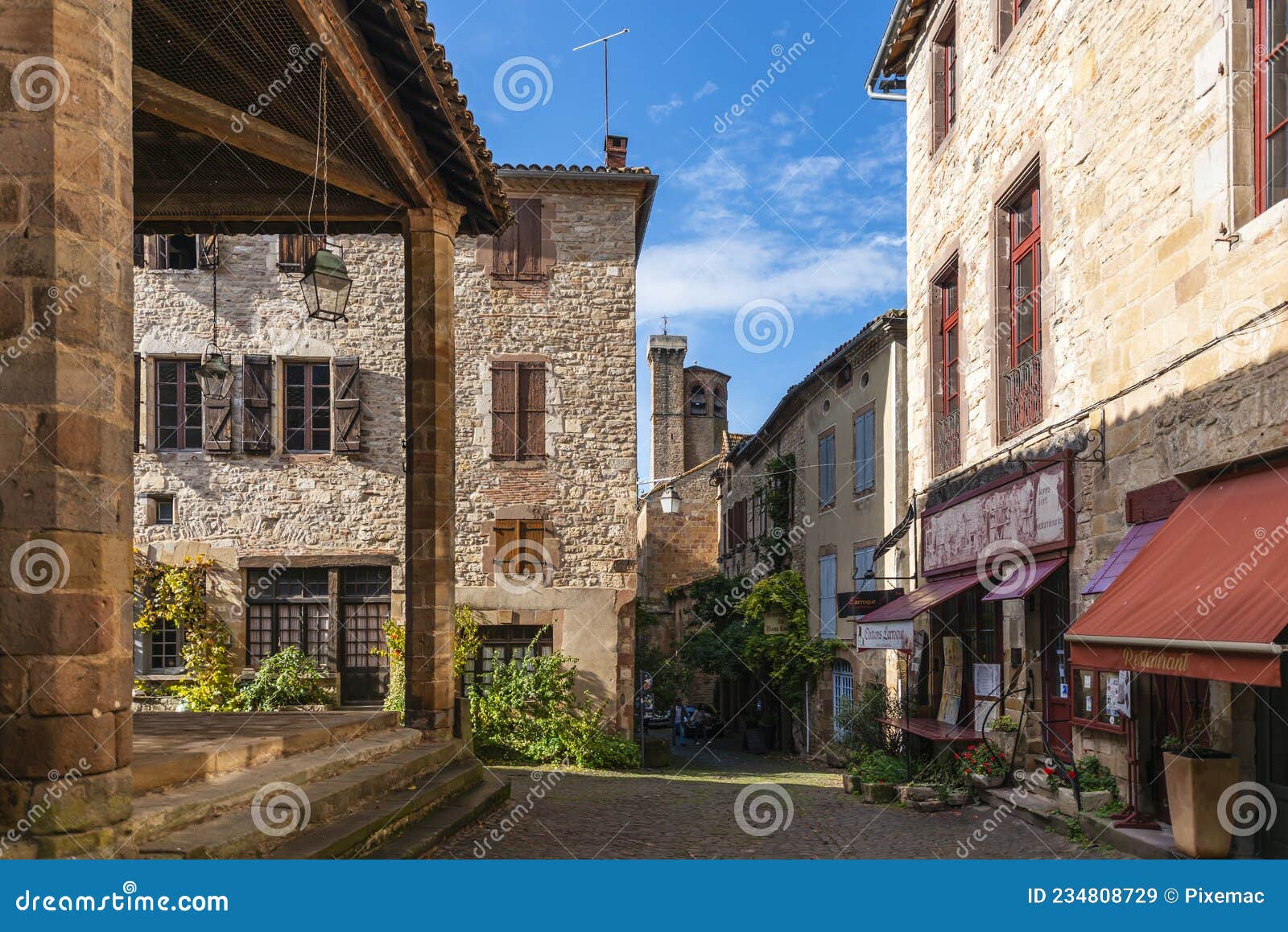 old street in the medieval village of cordes sur ciel in autumn, in the tarn, occitanie, france