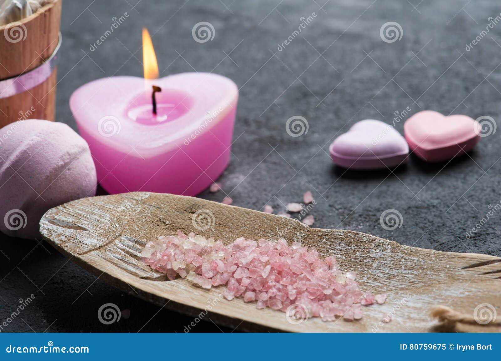 bath bomb closeup with pink lit candle