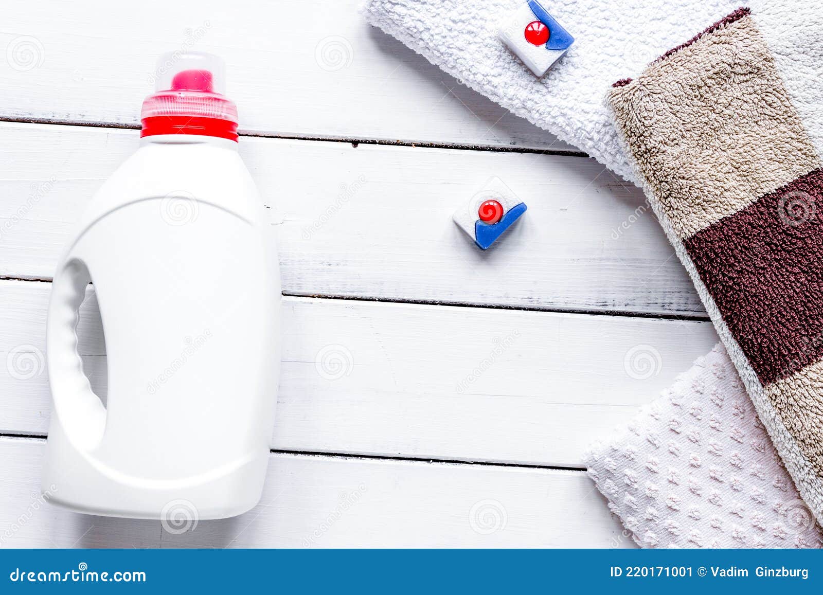 Bath Towels Stack with Detergent Bottle in Laundry Light Background Top