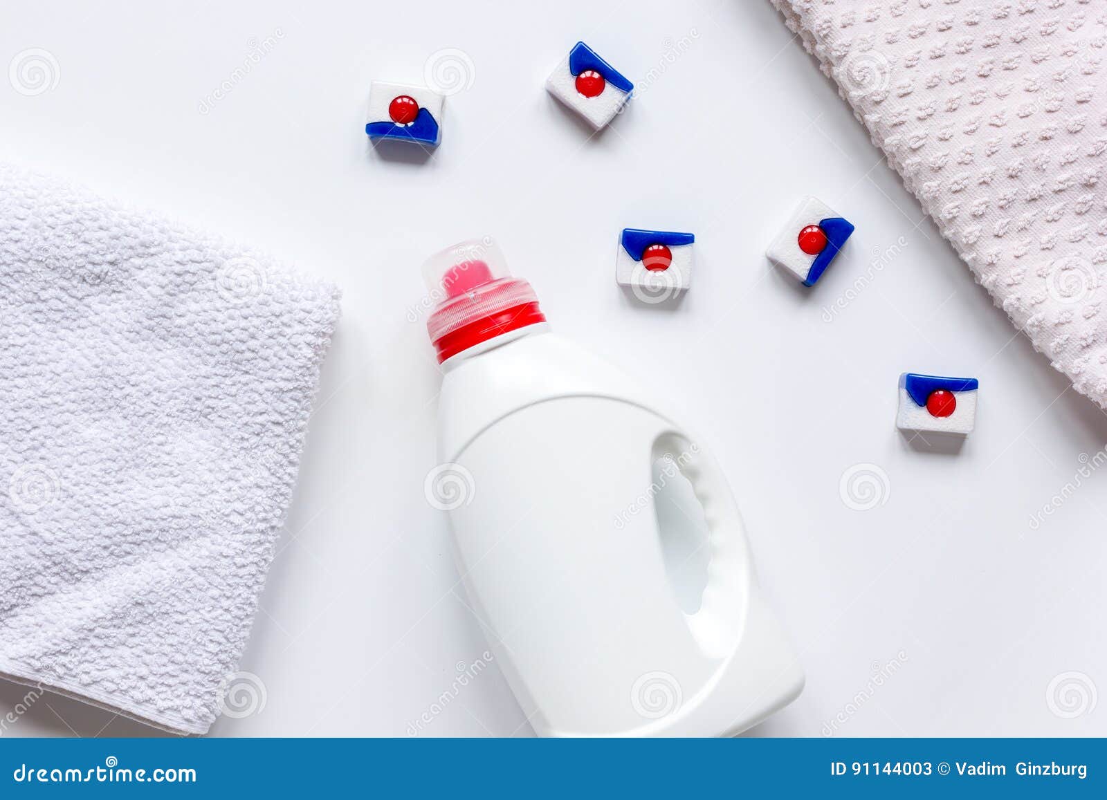 Bath Towels Stack with Detergent Bottle in Laundry Light Background Top
