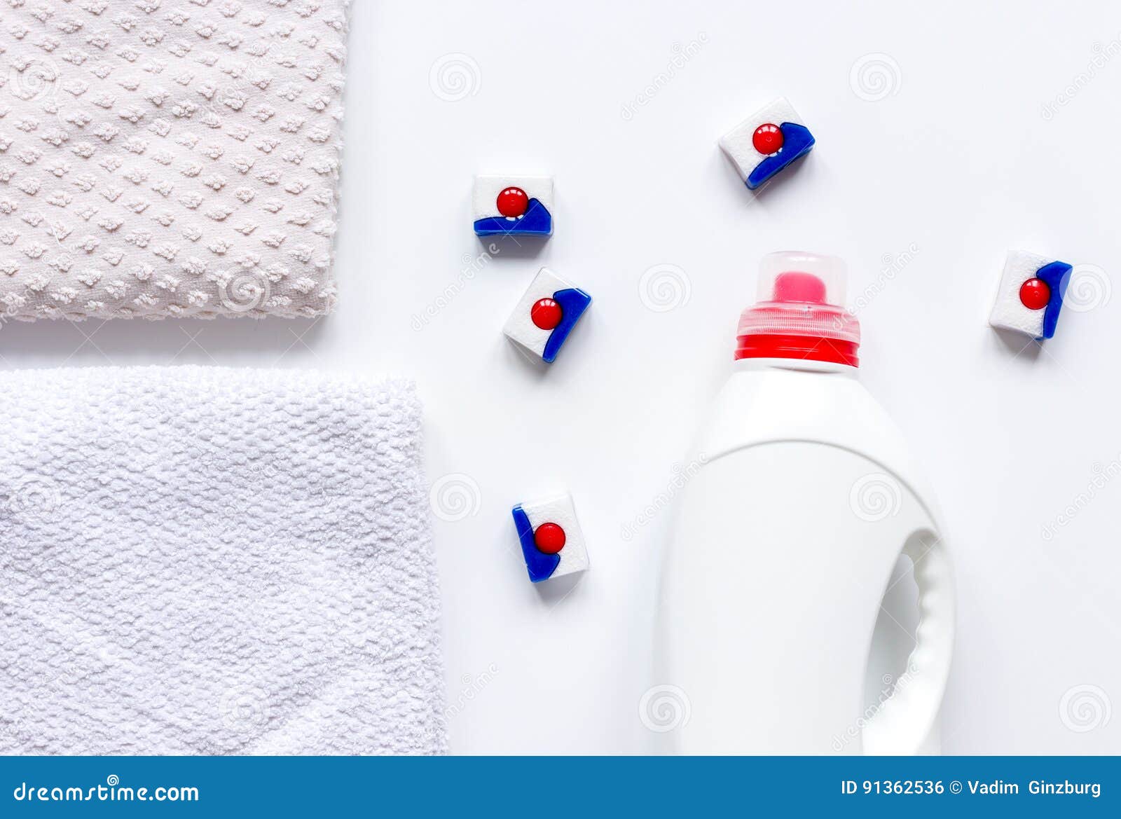 Bath Towels Stack with Detergent Bottle in Laundry Light Background Top