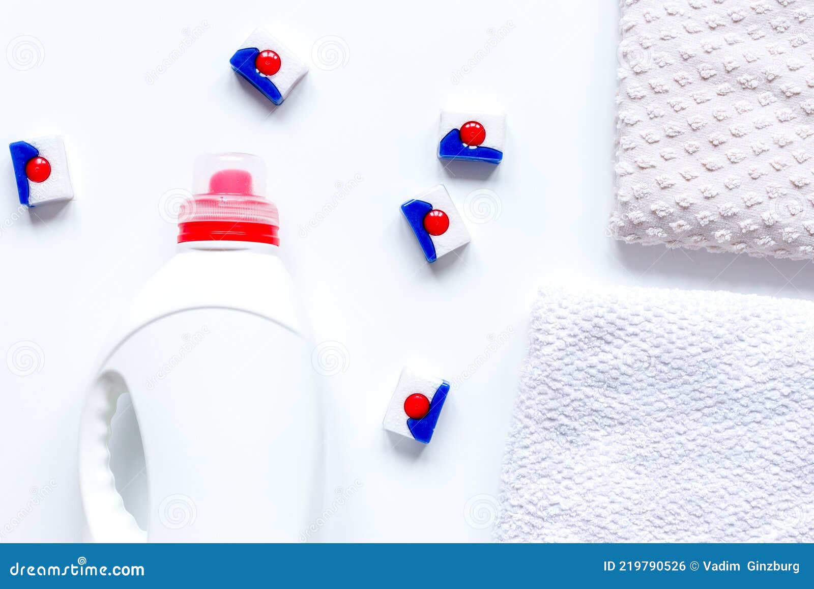 Bath Towels Stack with Detergent Bottle in Laundry Light Background Top