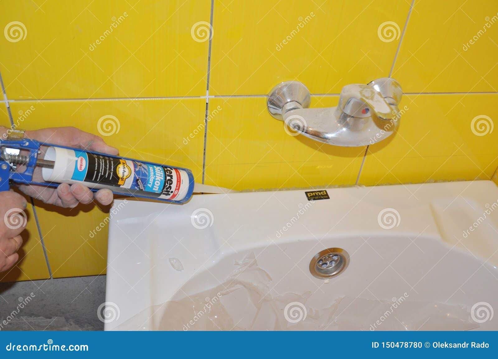 Bath Tube Installation With Silicone Bathroom Caulk Water Tap In The Yellow Tiled Bathroom Repair Bathroom With New Bath Tube Editorial Image Image Of Bath Yellow 150478780