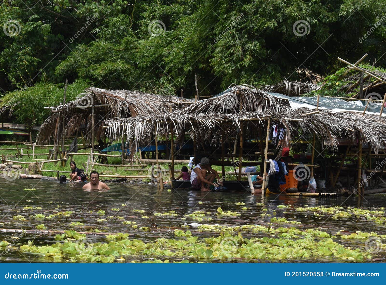 Bathing and Washing Clothes on the River Manila Philippines Editorial