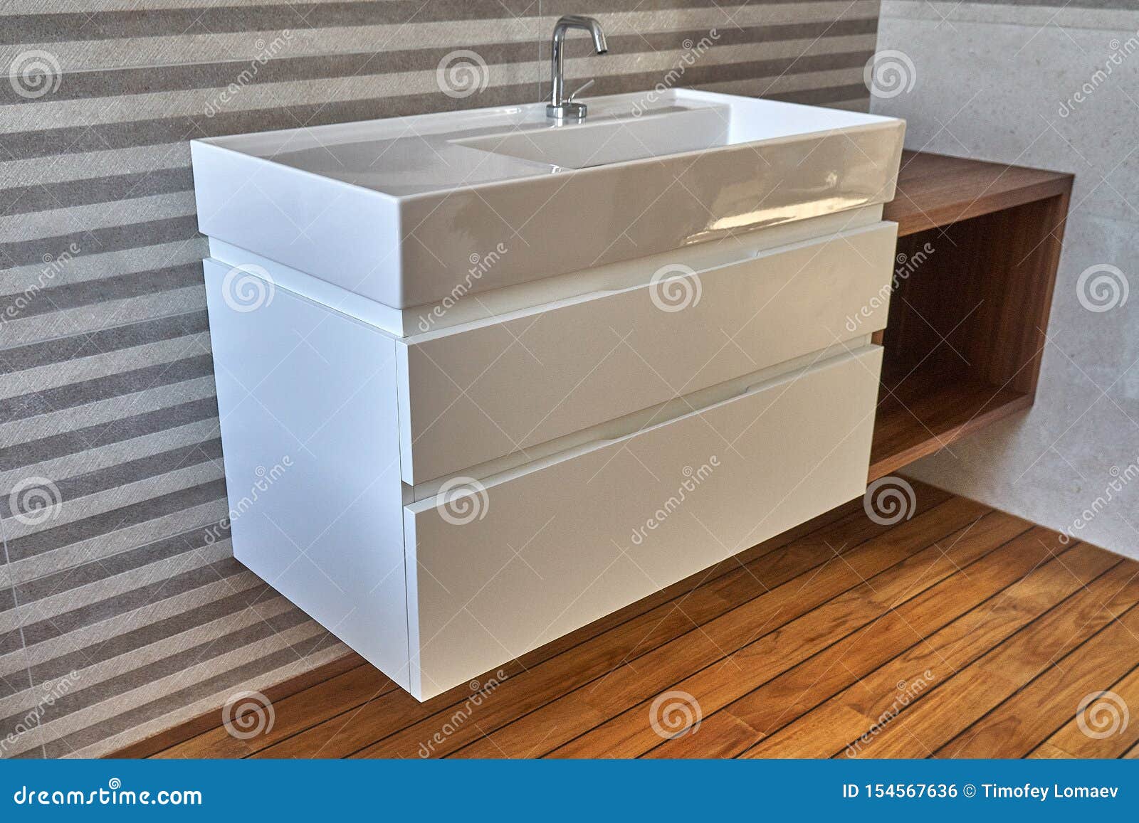 Wall Mounted Bathroom Vanity In Luxury Bathroom With Teak Floor