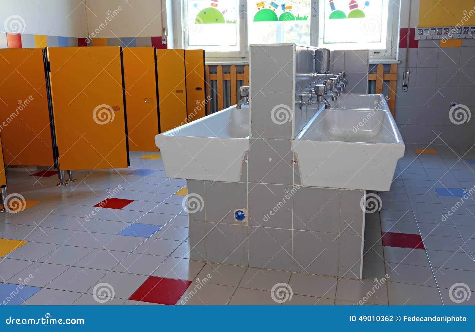 Bathroom of the Nursery School with Ceramic Sinks Stock Photo Image