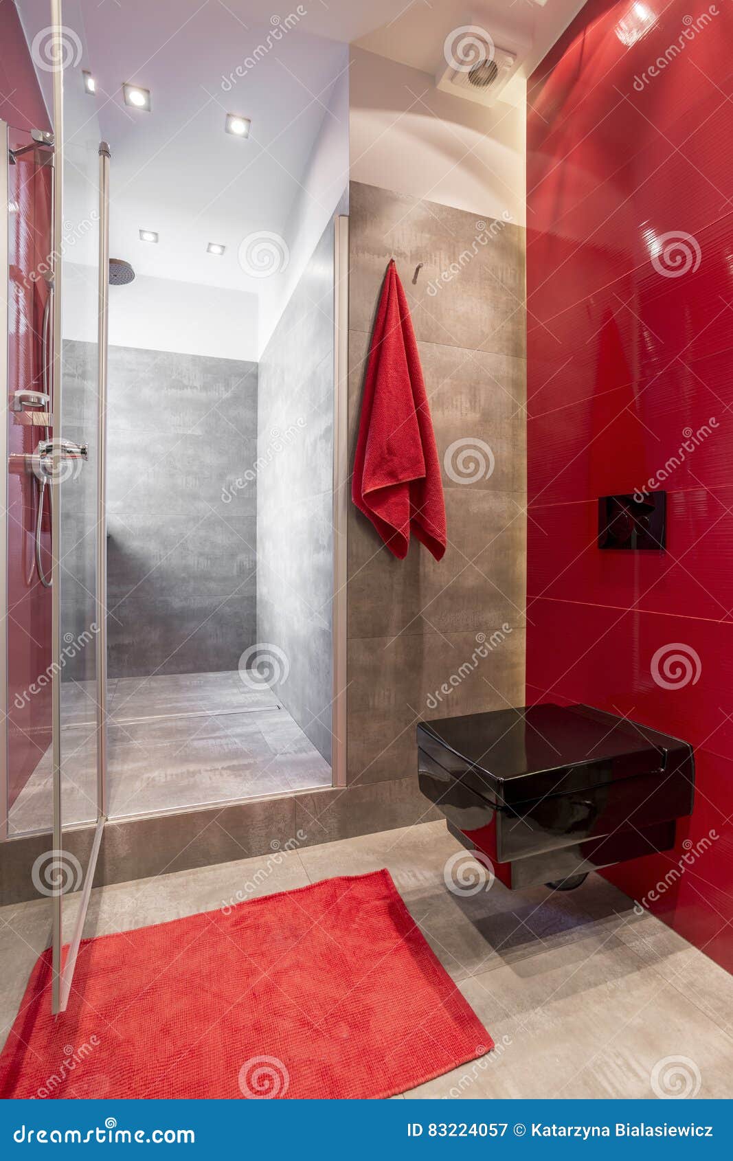 Bathroom with red wall stock image. Image of lighted 83224057
