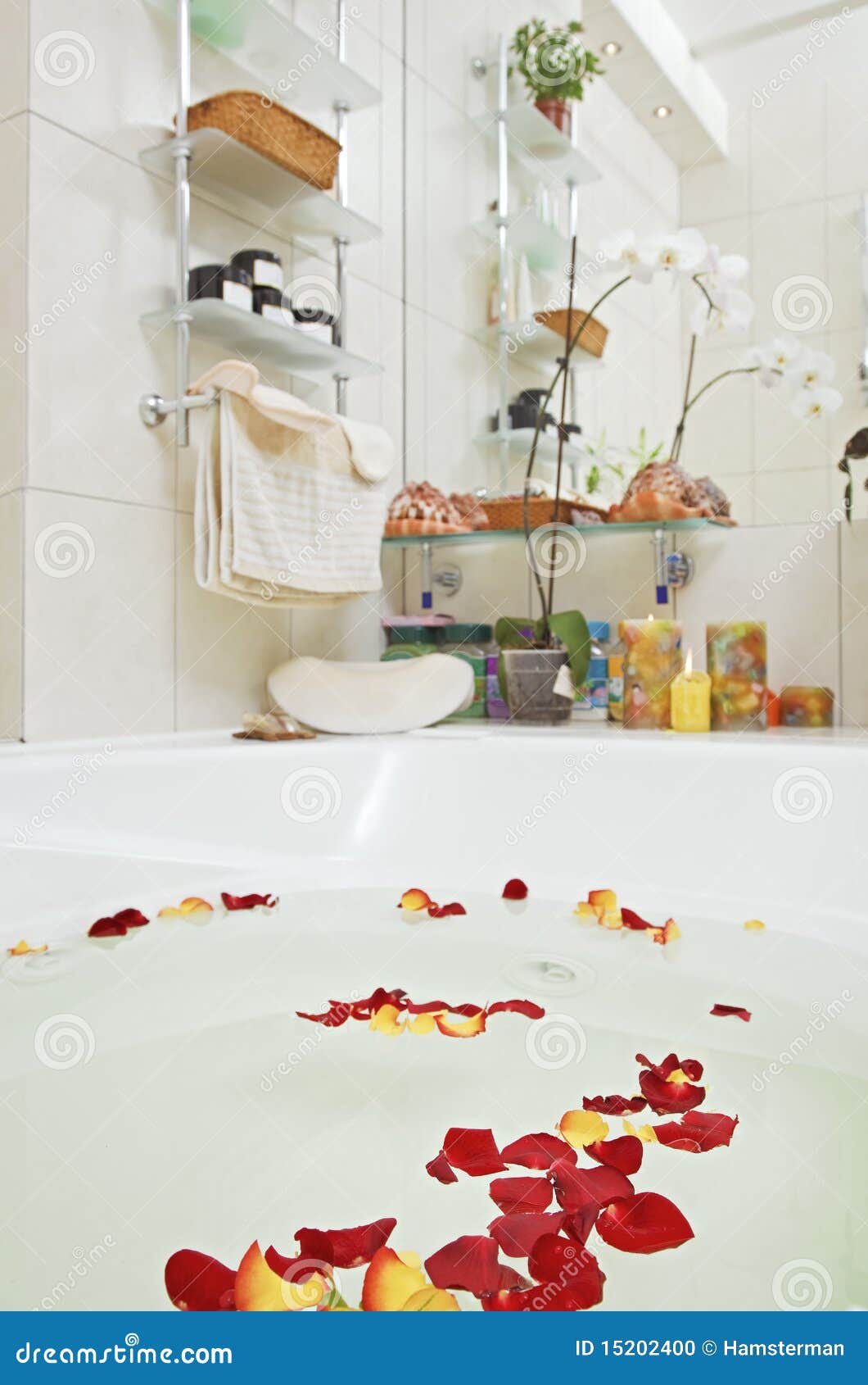 Bathroom with rose petals stock photo. Image of swirling 15202400