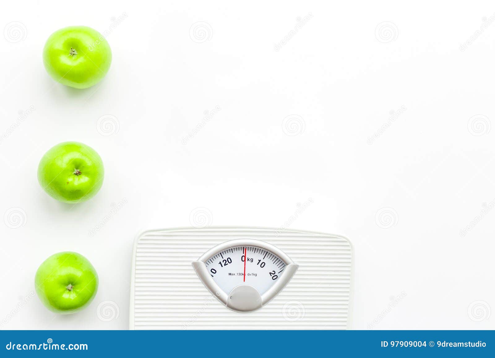 Bathroom Scale and Apples on White Background Top View Copyspace Stock