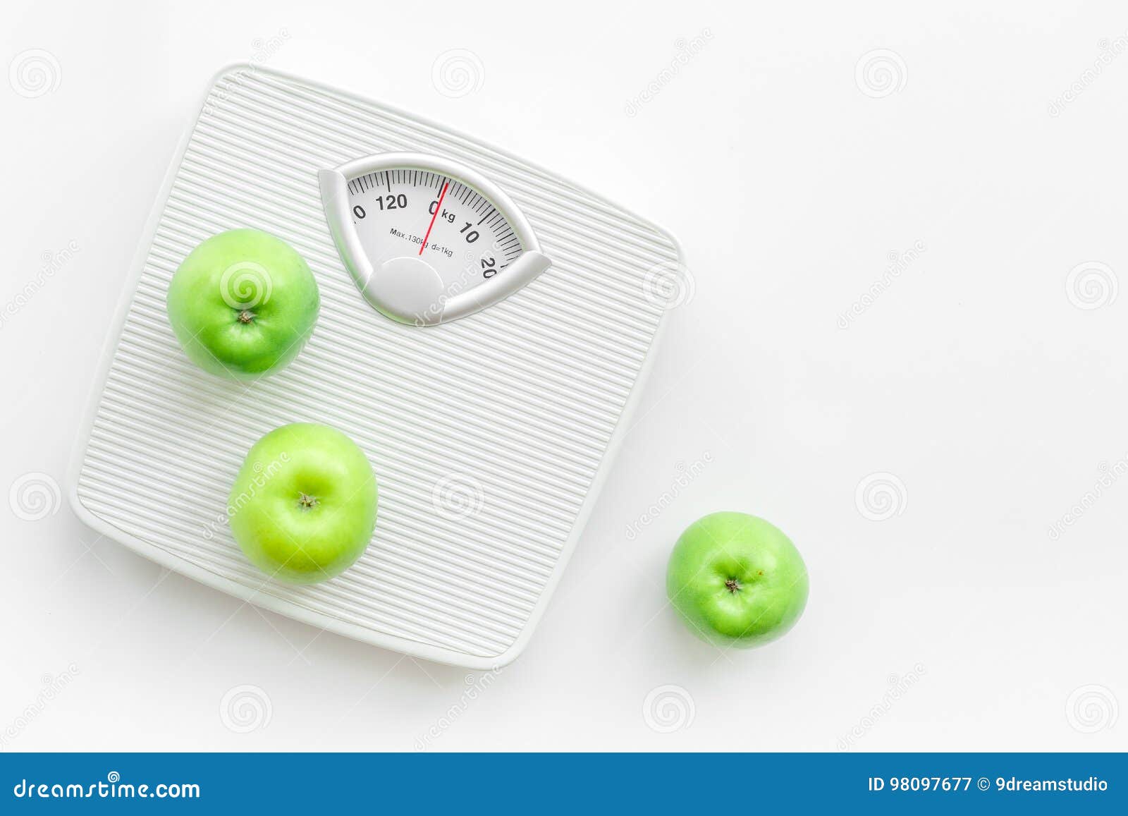 Bathroom Scale and Apples on White Background Top View Copyspace Stock