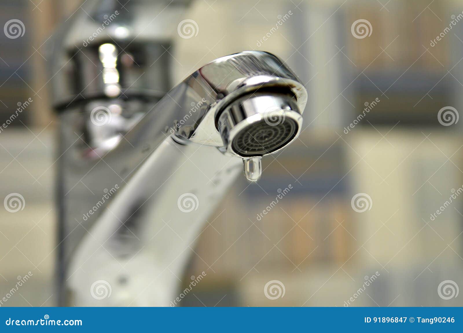 bathroom tap leaking water drops