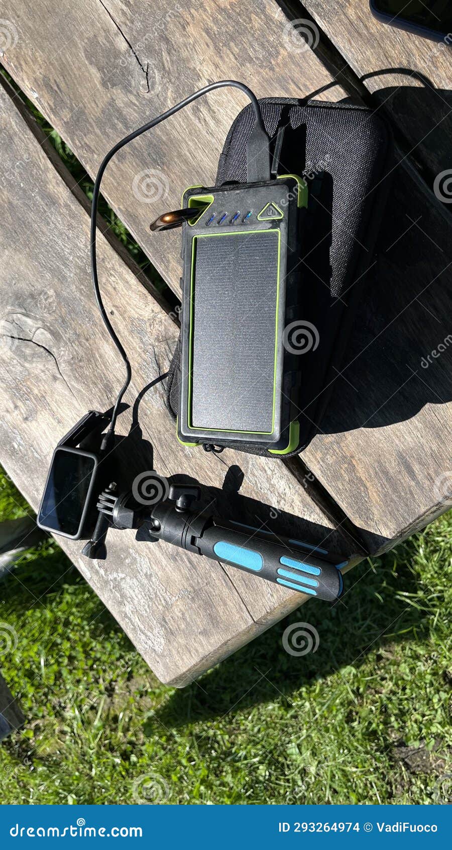 Battery with Solar Panel for Charging Gadgets while Camping Stock Photo