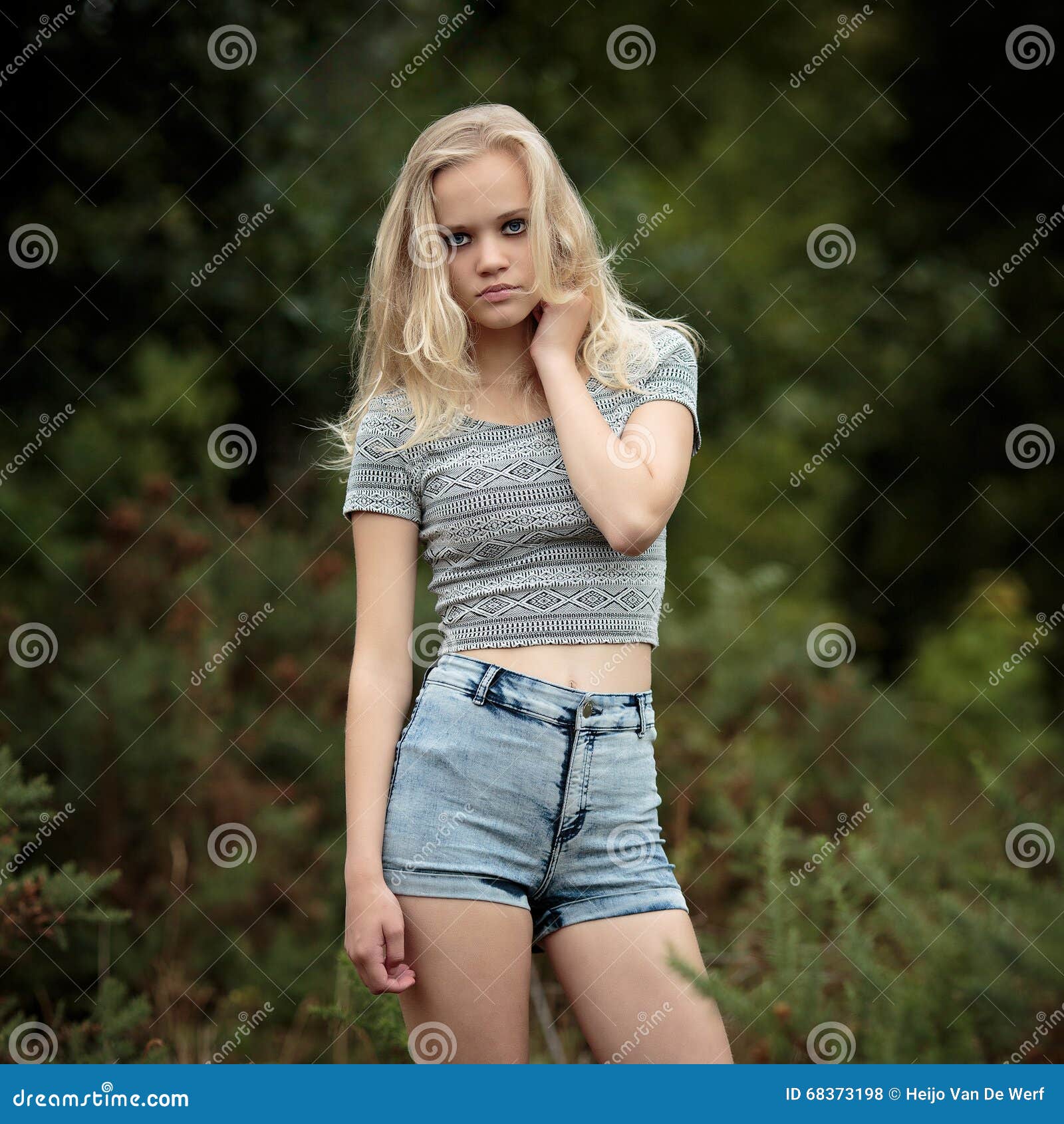Blond Teenage Girl Smiling Outside On Park Bench Copy 