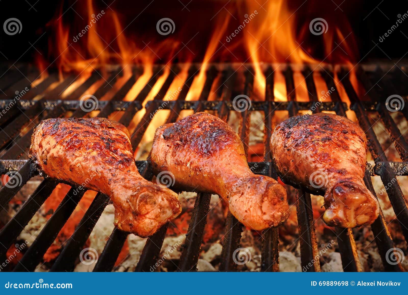 bbq chicken legs roasted on hot charcoal grill