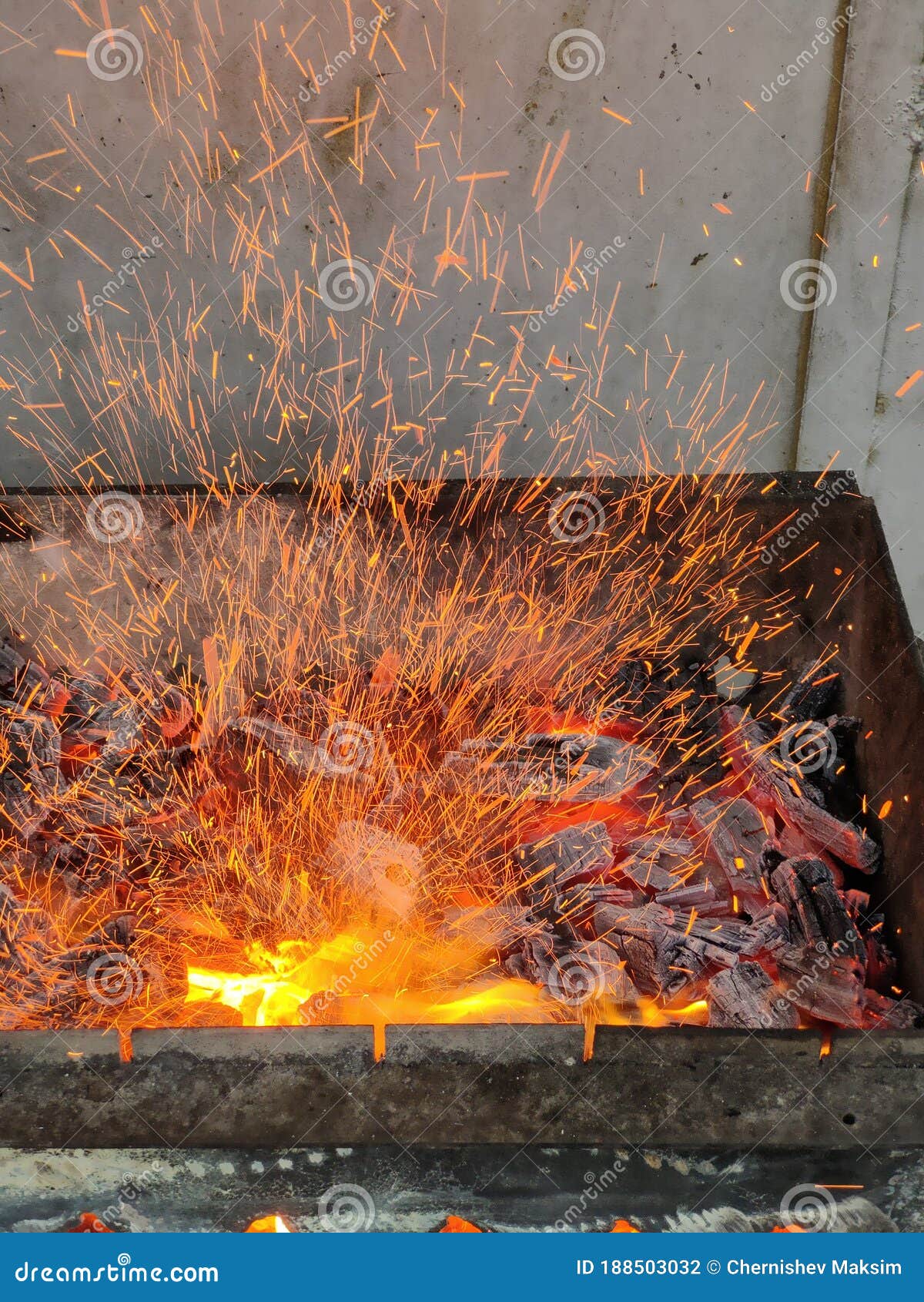 BBQ on Fire with Burning Charcoal in Brazier and Flying Sparks Stock