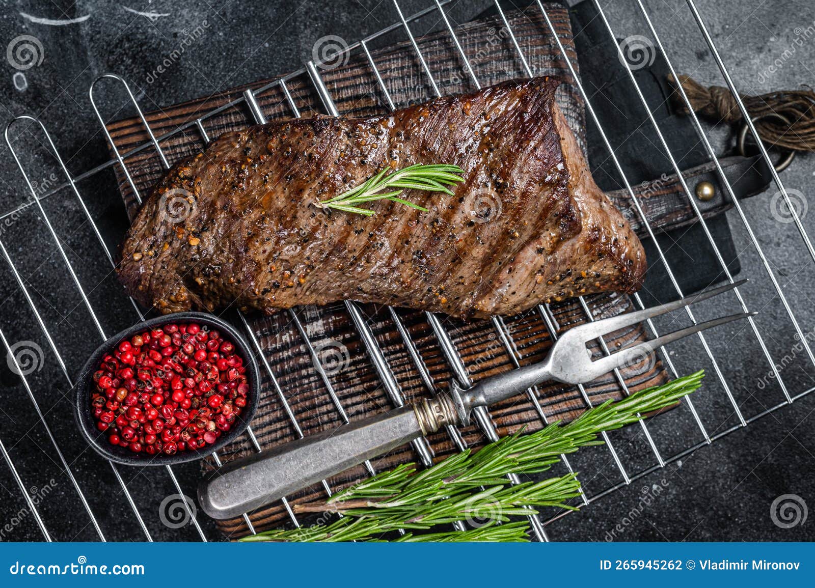 BBQ Grilled Tri Tip Beef Steak on a Grill. Black Background Stock Photo