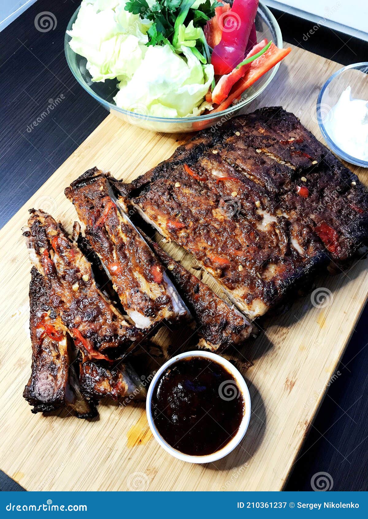 BBQ Ribs Marinated Pork Ribs with Barbeque Sauce Dip. Stock Image