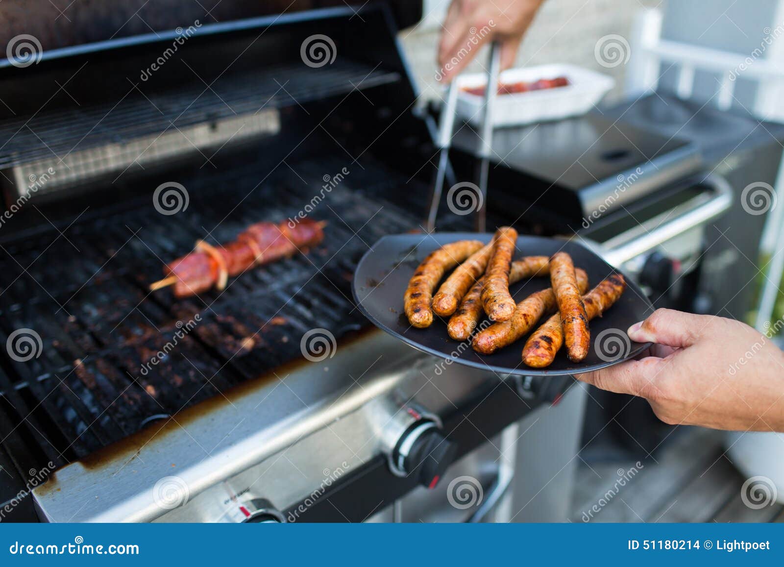 bbq with sausages and red meat on the grill