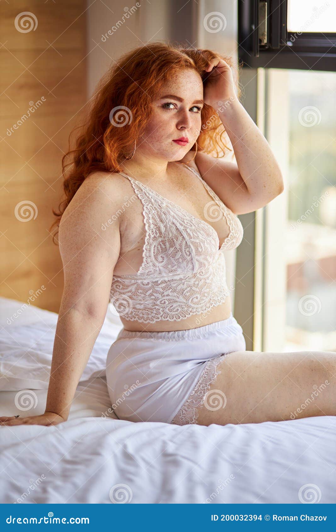 BBW Big Beautiful Caucasian Woman Showing Off Overweight Figure Wearing Lingerie Stock Photo