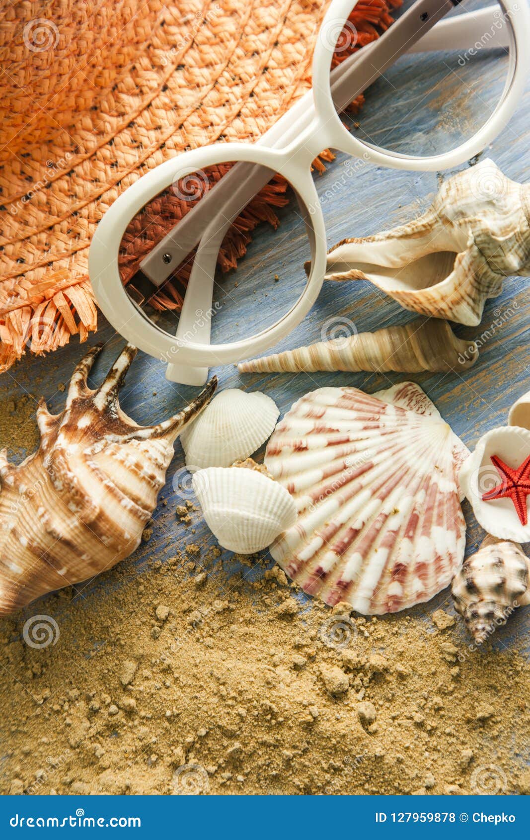Beach Accessories Glasses Hat Cockleshells on Wood Deck. Stock Photo