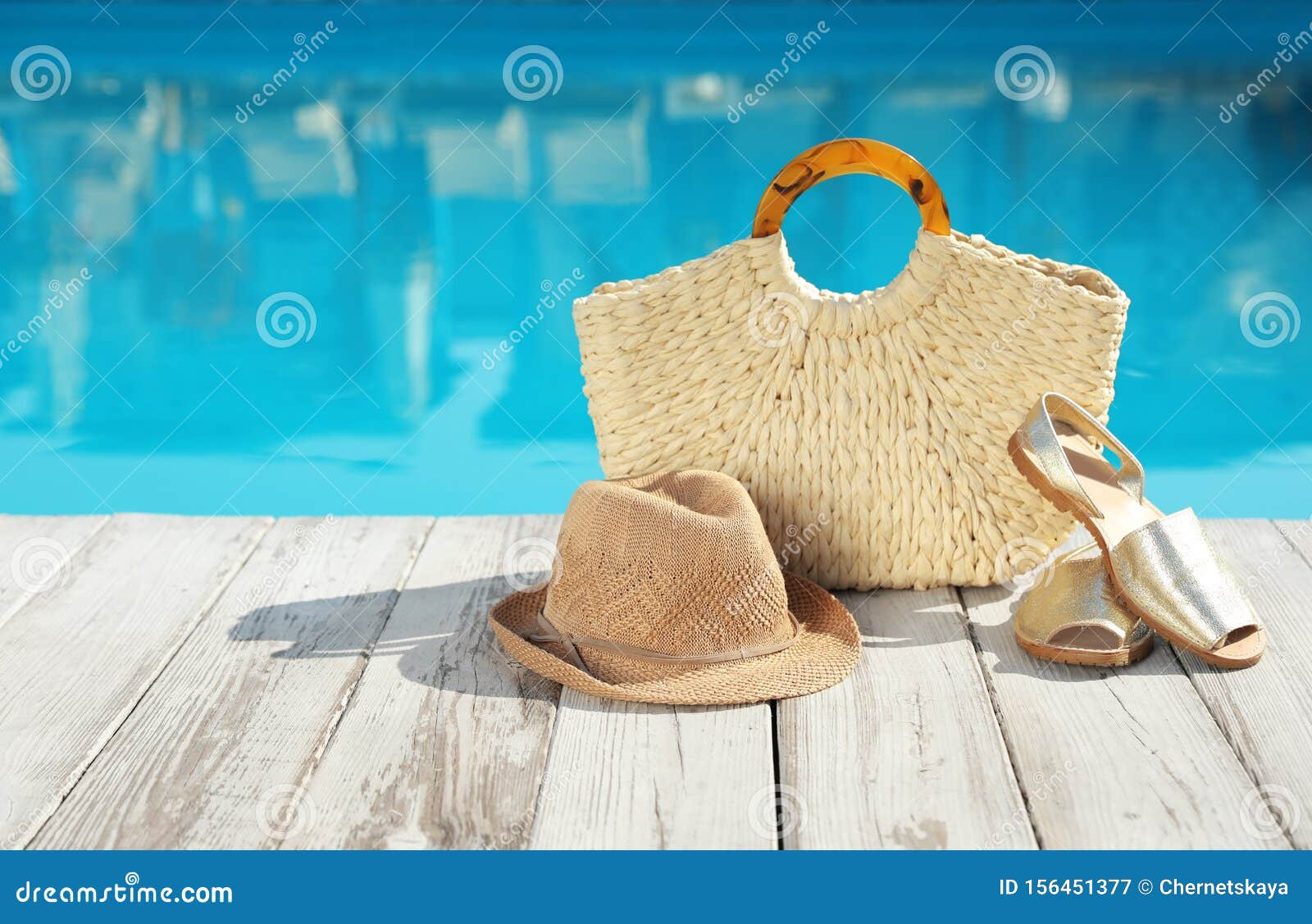 Beach Accessories On Wooden Near Outdoor Swimming Pool ...