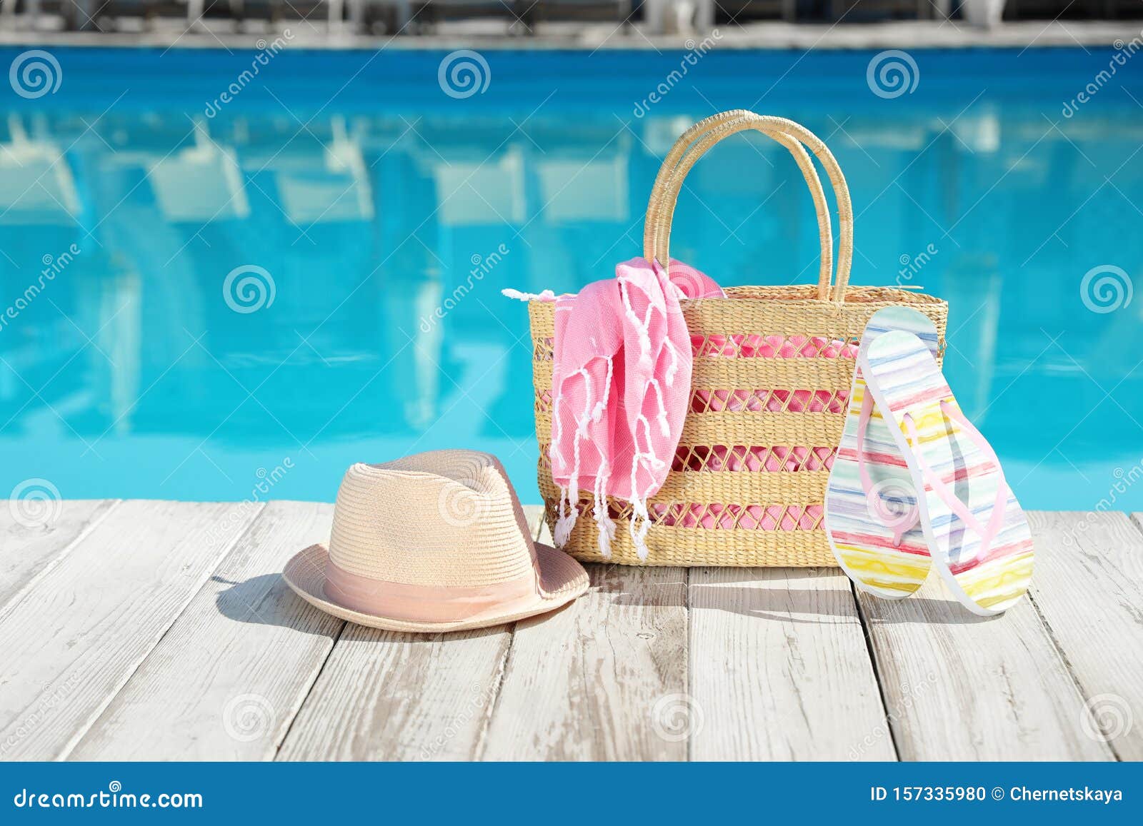 Beach Accessories On Wooden Deck Near Swimming Pool Stock ...