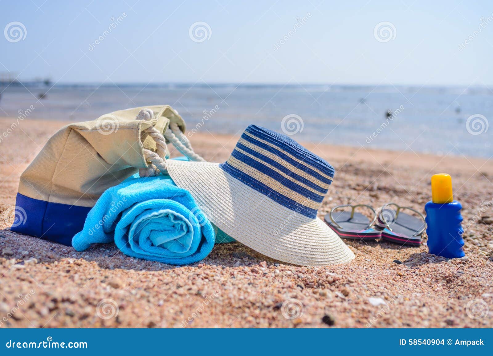 Beach Bag and Sun Hat on Sunny Sandy Beach Stock Photo - Image of ...