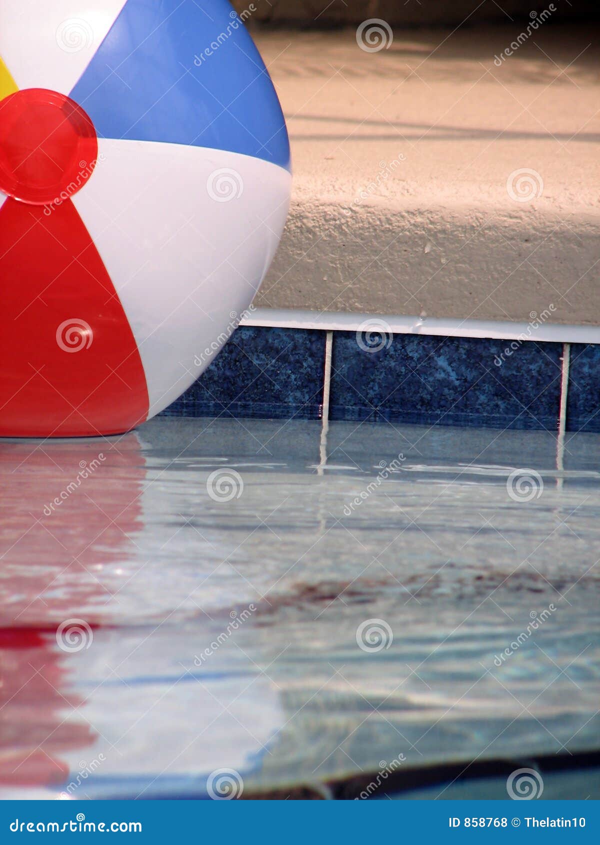 Beach Ball in the Pool stock photo. Image of reflections 858768