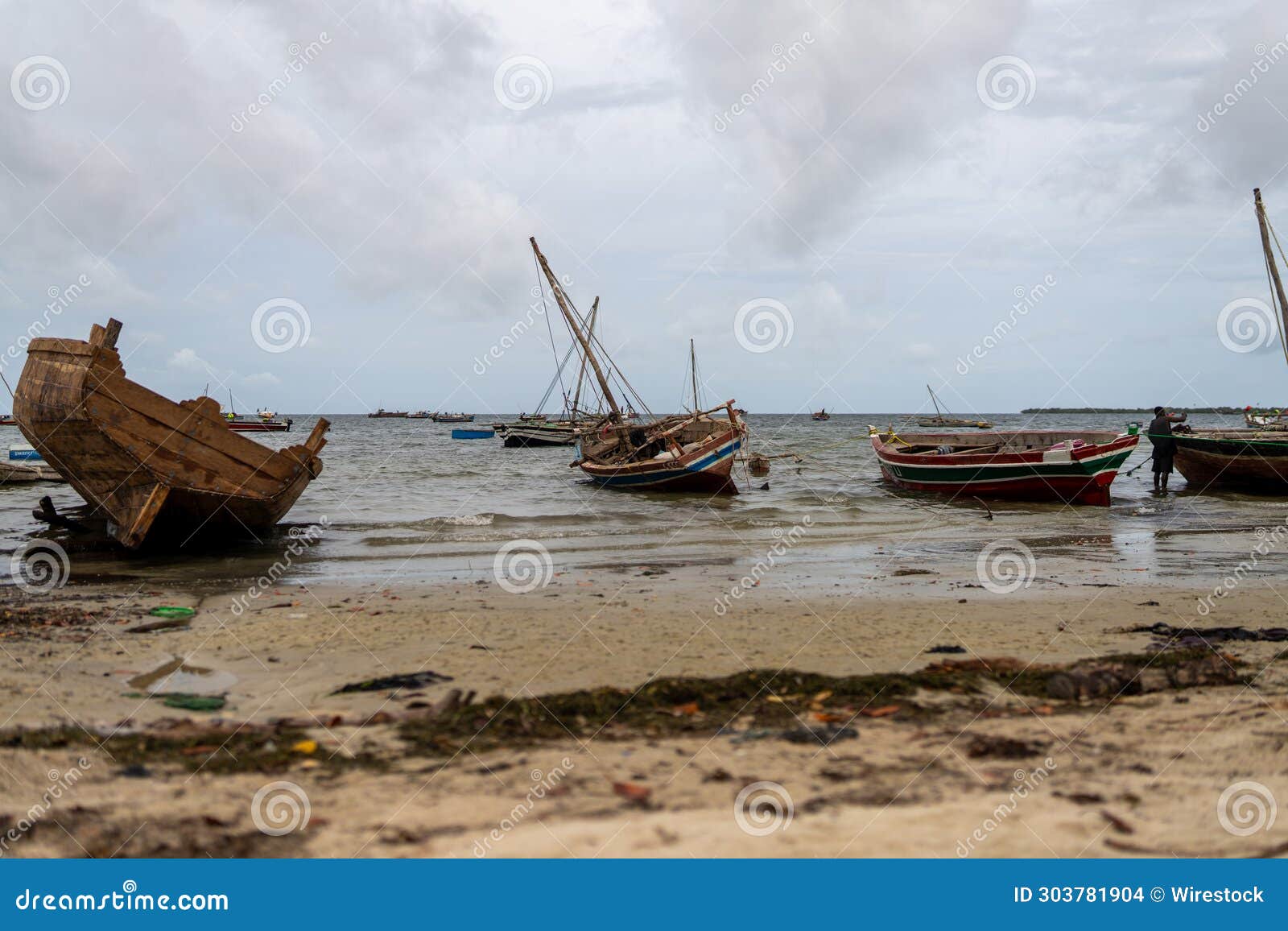 beach with boats in mocimboa da praia in cabo delgado province, mozambique