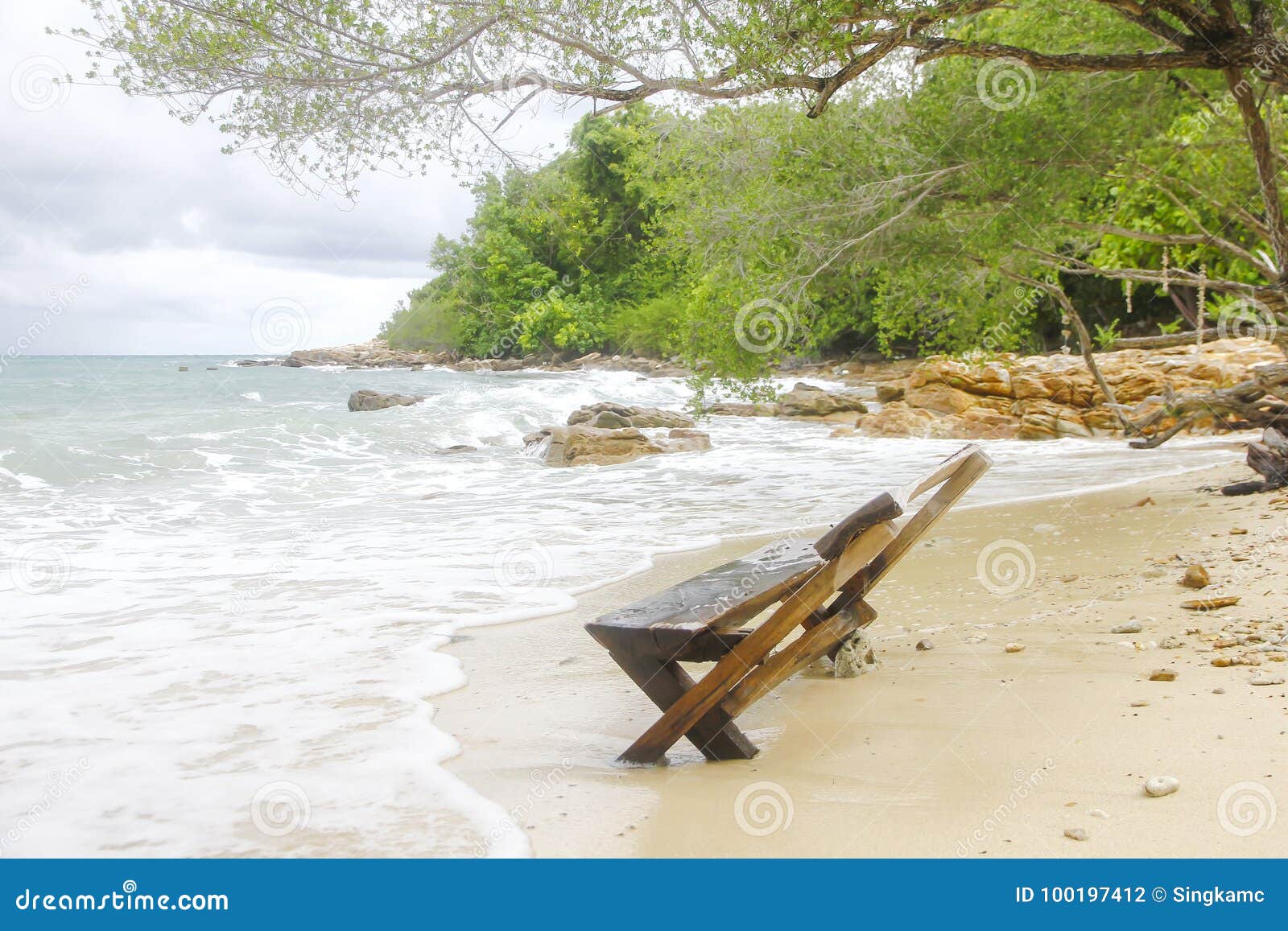 wooden canvas chair on a beautiful tropical beach