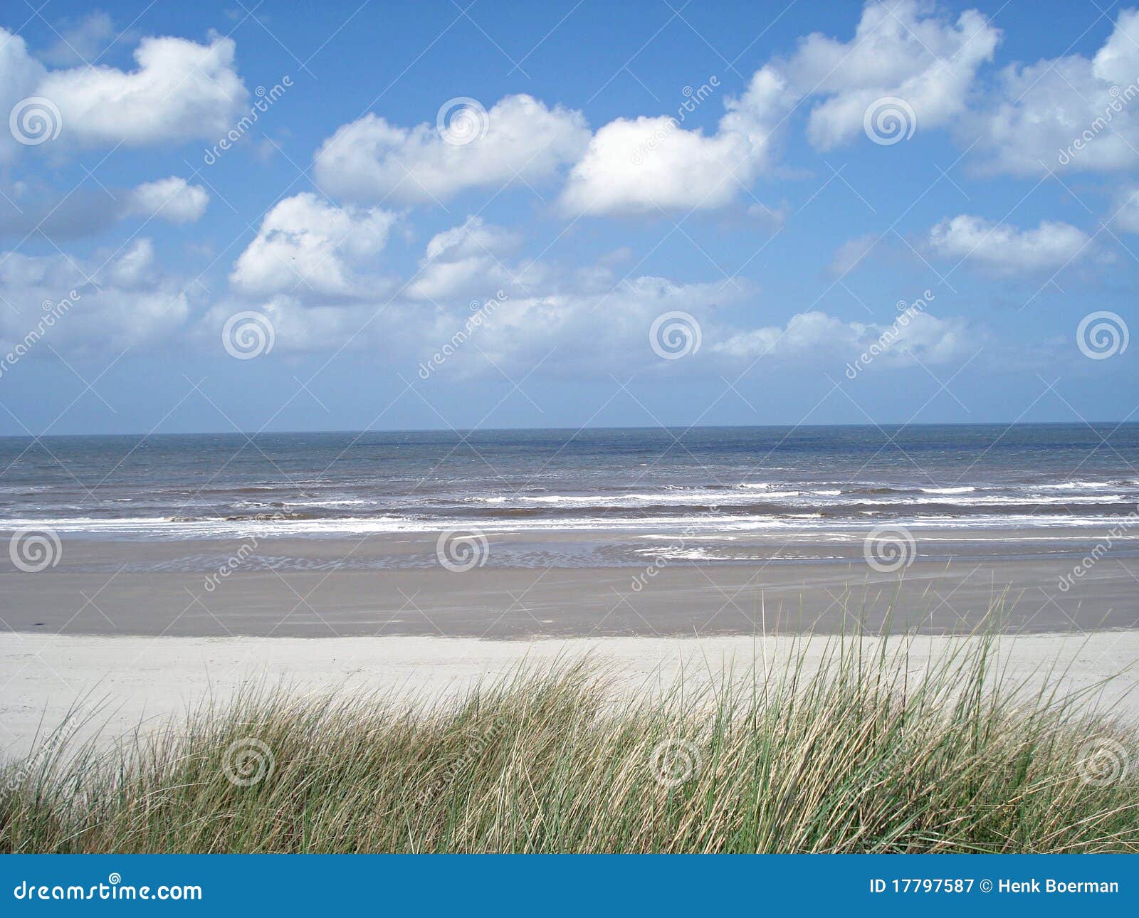 beach with clouds and blue skie