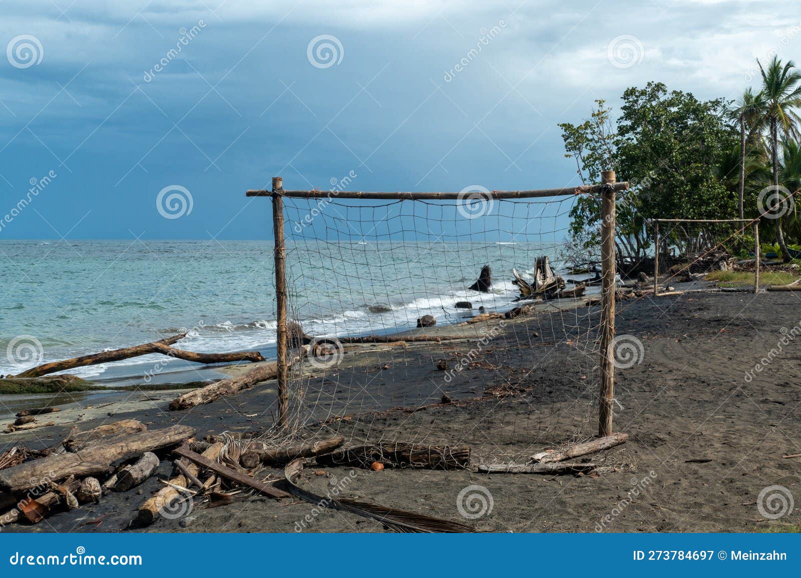 beach of cocles on the caribbean side of costa rica, puerto viejo de talamanca with an handmade soccer coal made of palm trees