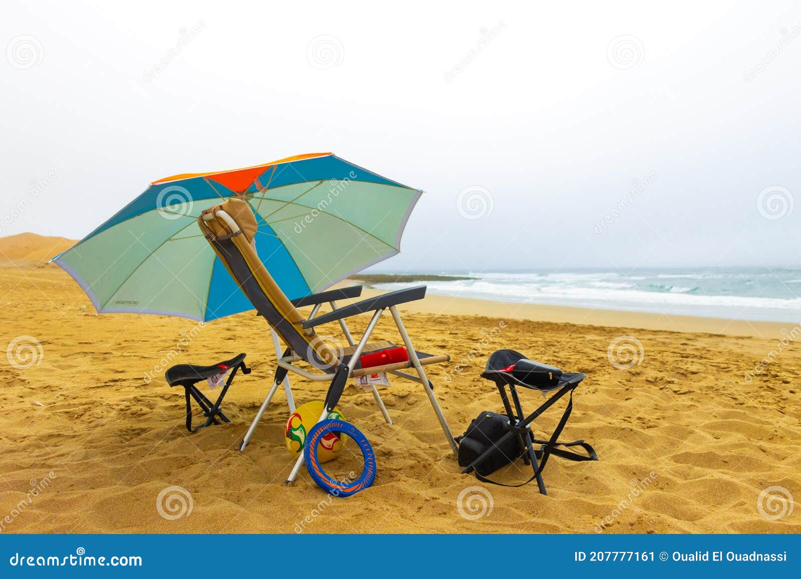 Beach Decathlon Umbrella, Quechua Chairs, a Freesbe and a JBL Flip 4 Hight Speaker Editorial Photo - Image of chilling, invertebrate: