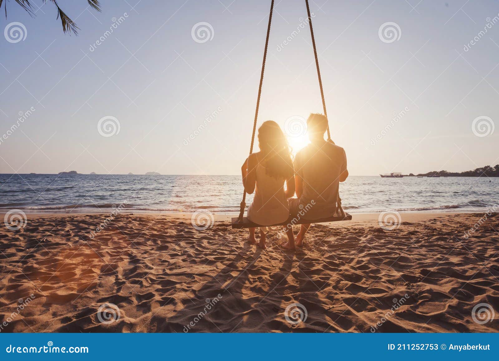 beach holidays for romantic young couple, honeymoon vacations, silhouettes of man and woman
