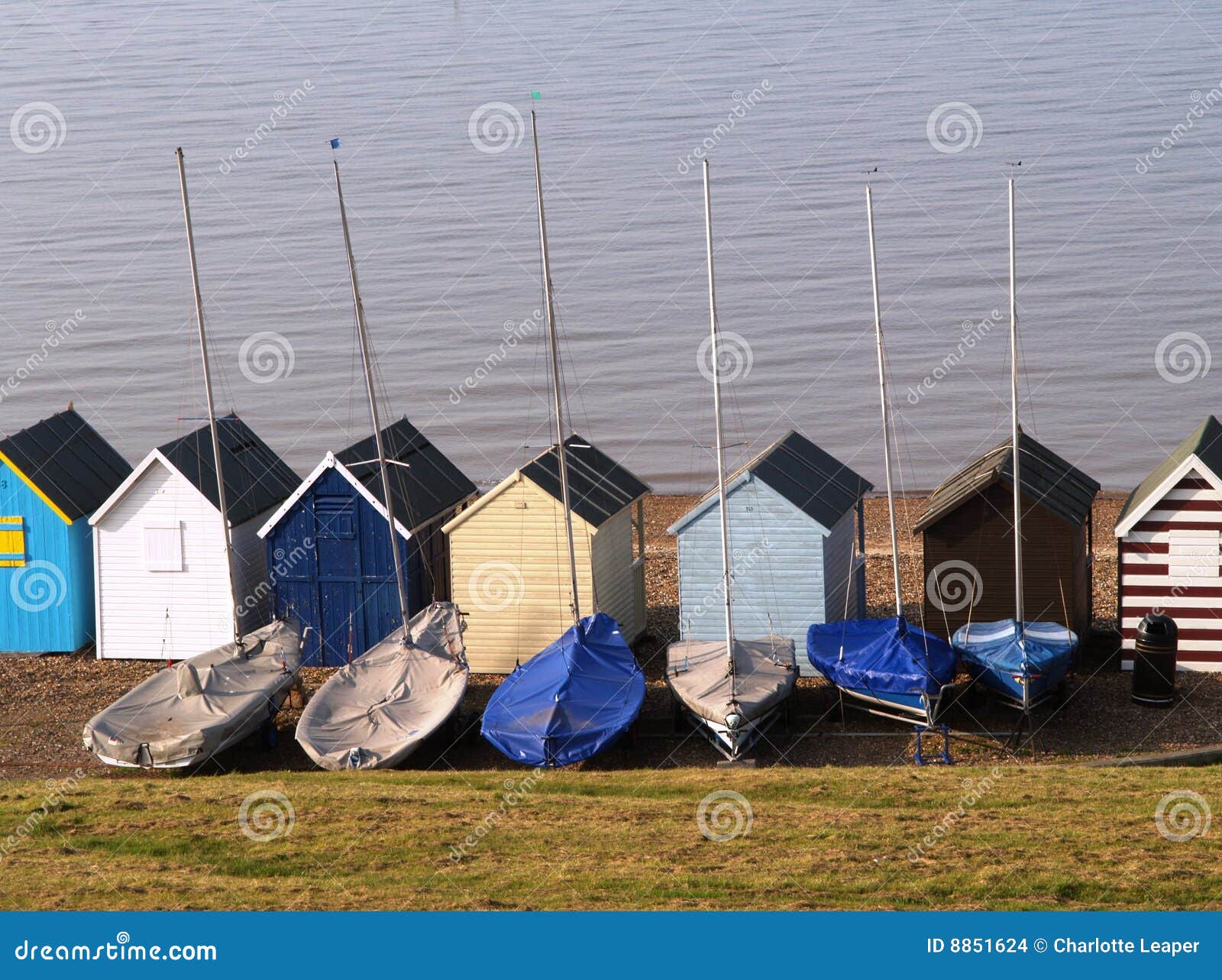 beach huts and sailing boats