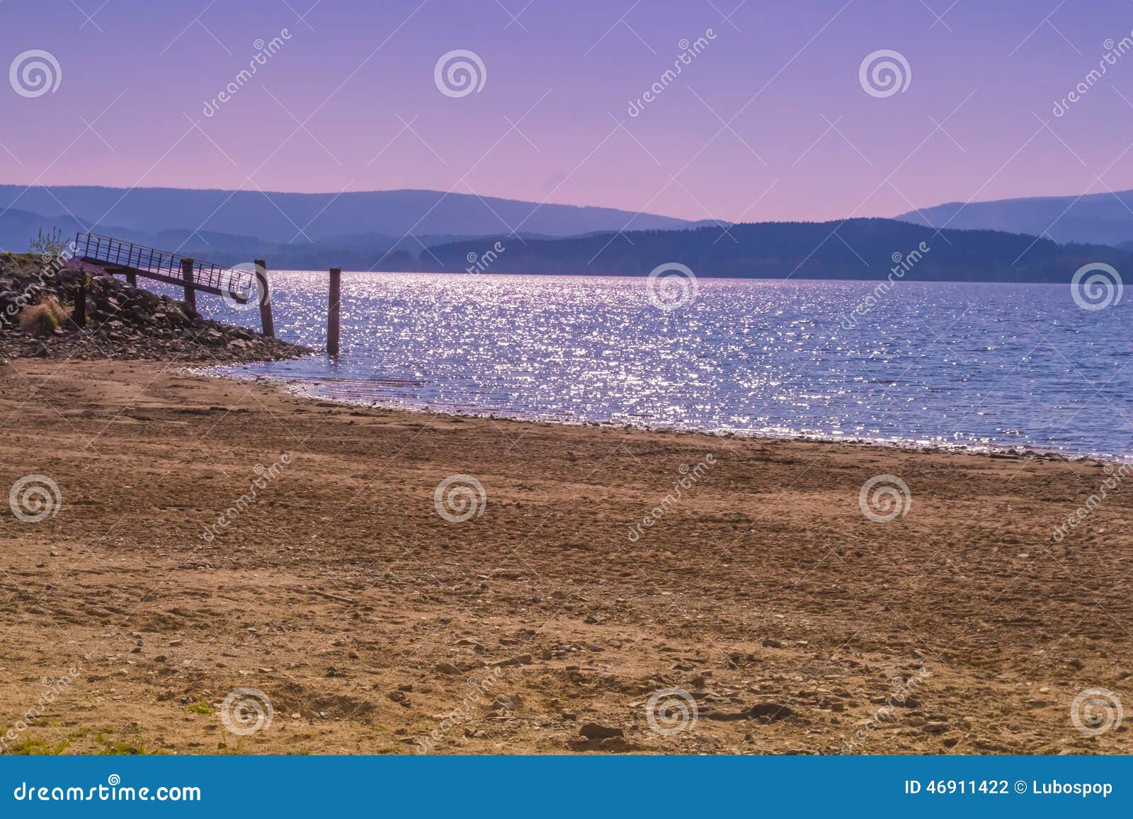 Beach with landing stage on Lipno lake