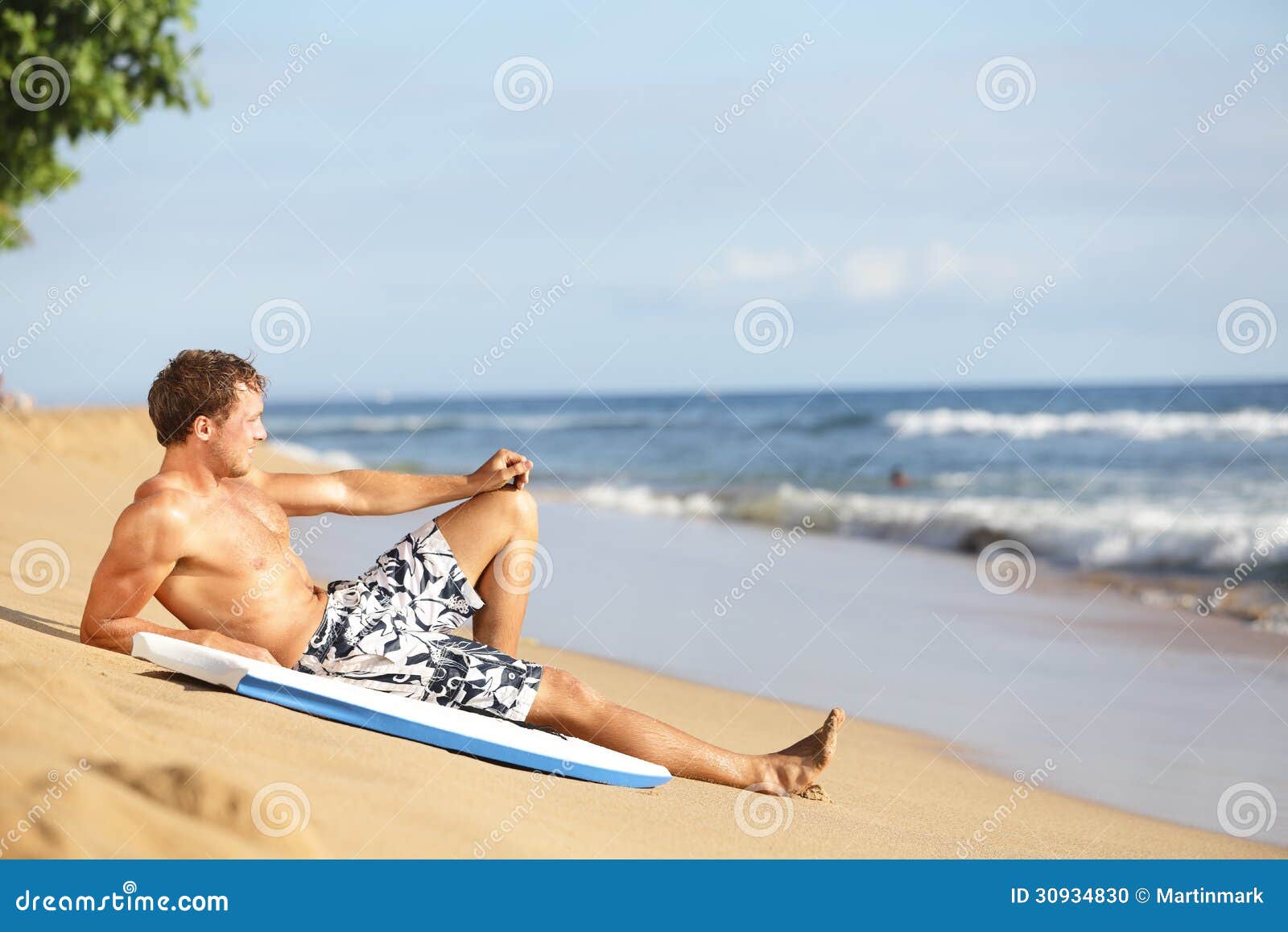 Beach Man Relaxing After Surfing Stock Photo Image Of Down