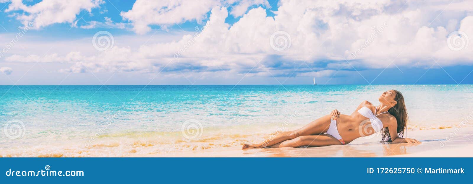 Beach Paradise Bikini Woman Lying Down On Sand Relaxing Sun Tanning In