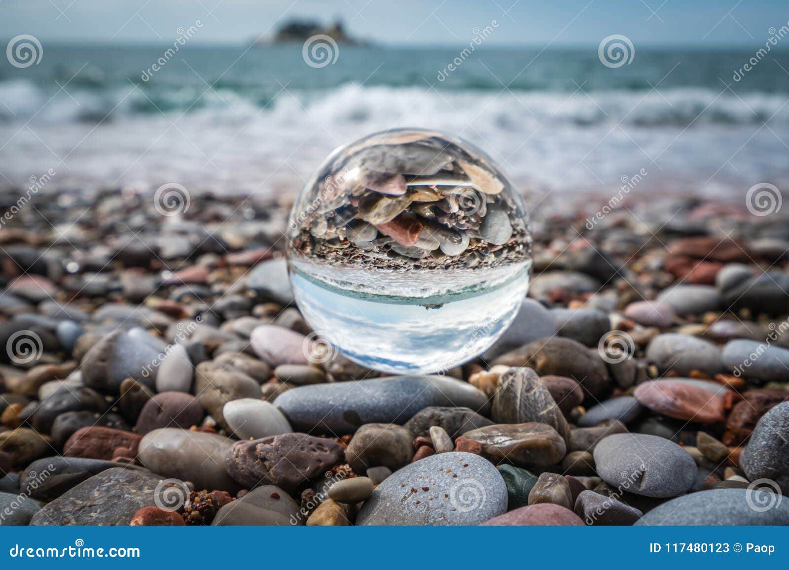 Beach Peebles Reflected in a Glass Ball Stock Image - Image of coastal,  buildings: 117480123