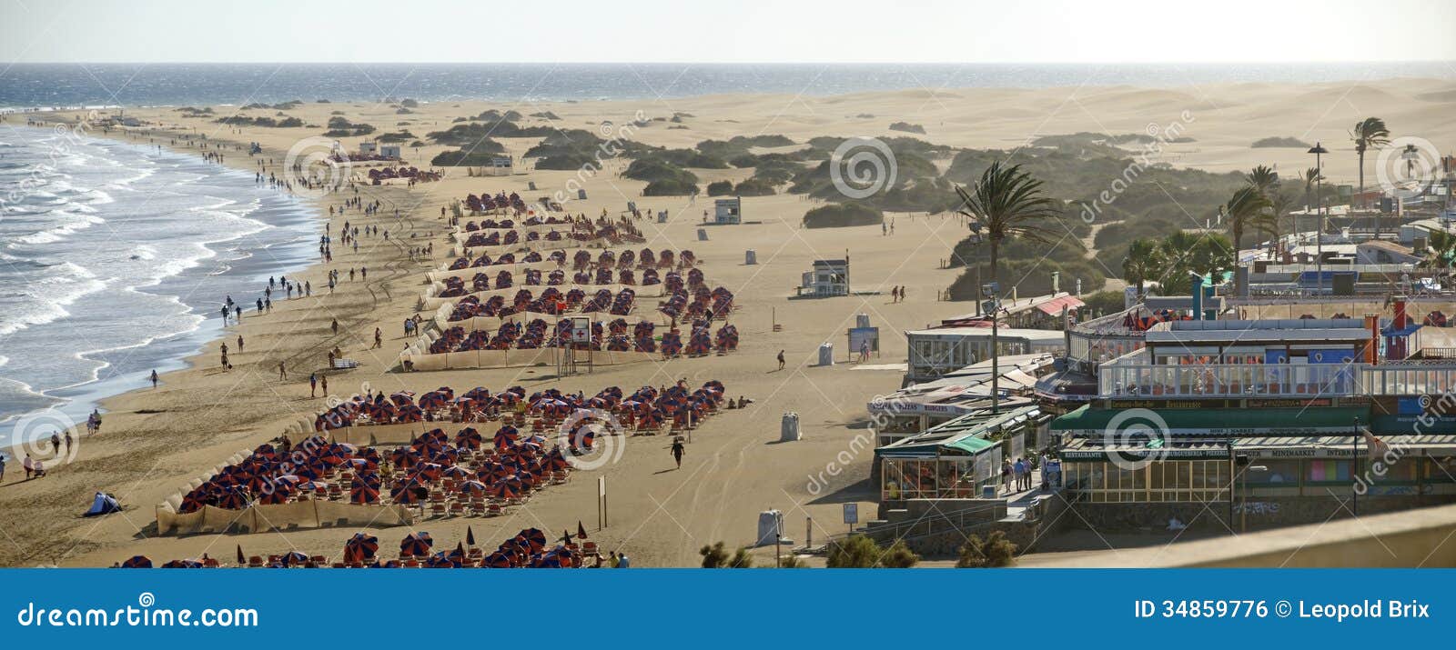 beach of playa del ingles with sunshades
